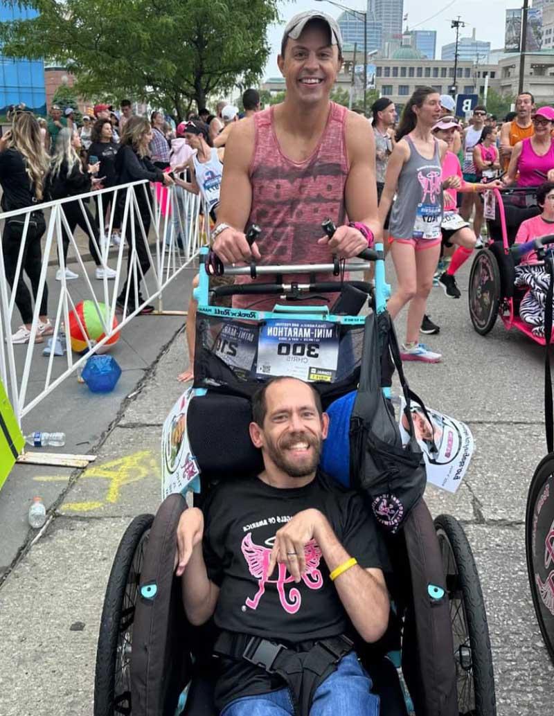 Jason Shaw pushes Chris Kemp to finish a half-marathon in Indianapolis in May 2024, three years after Shaw's heart attack. (Photo courtesy of Jason Shaw)